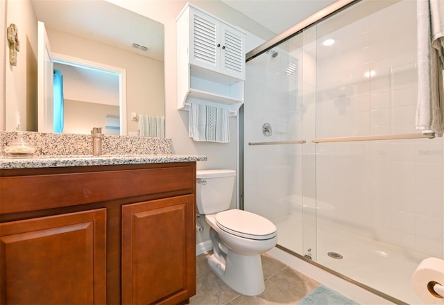 6416 Cobble Bliss St, Zephyrhills, FL 33541 - full bathroom featuring visible vents, toilet, vanity, a stall shower, and tile patterned flooring