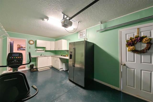 6416 Cobble Bliss St, Zephyrhills, FL 33541 - interior space with stainless steel fridge with ice dispenser, baseboards, a garage door opener, and a sink
