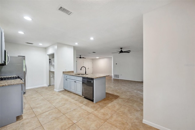 1308 W Perdiz St, Tampa, FL 33612 - kitchen with visible vents, a sink, light stone countertops, black dishwasher, and ceiling fan