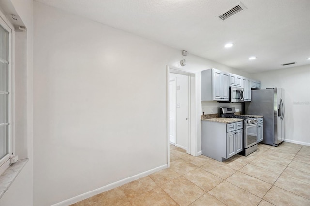 1308 W Perdiz St, Tampa, FL 33612 - kitchen featuring recessed lighting, visible vents, baseboards, and stainless steel appliances