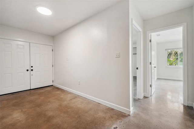 1308 W Perdiz St, Tampa, FL 33612 - entrance foyer with baseboards and concrete flooring