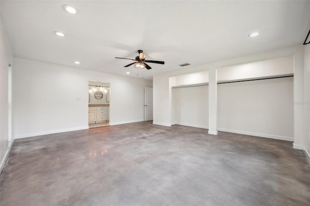 1308 W Perdiz St, Tampa, FL 33612 - unfurnished bedroom with multiple closets, baseboards, recessed lighting, and finished concrete flooring