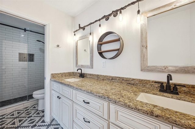 1308 W Perdiz St, Tampa, FL 33612 - full bathroom featuring a sink, a shower stall, double vanity, and toilet