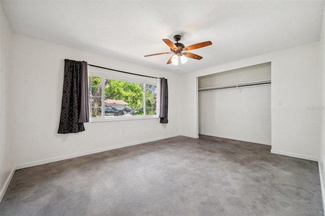 1308 W Perdiz St, Tampa, FL 33612 - unfurnished bedroom with concrete floors, baseboards, a ceiling fan, and a closet