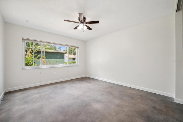 1308 W Perdiz St, Tampa, FL 33612 - unfurnished room featuring ceiling fan, concrete floors, and baseboards