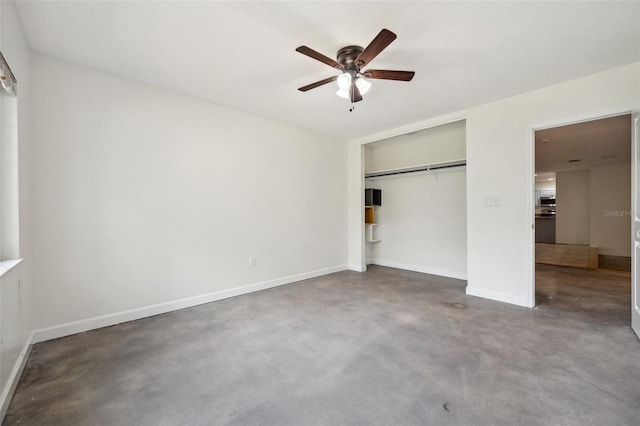 1308 W Perdiz St, Tampa, FL 33612 - unfurnished bedroom with a ceiling fan, baseboards, a closet, and finished concrete flooring