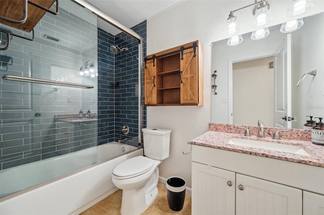1308 W Perdiz St, Tampa, FL 33612 - bathroom with tile patterned floors, bath / shower combo with glass door, toilet, baseboards, and vanity