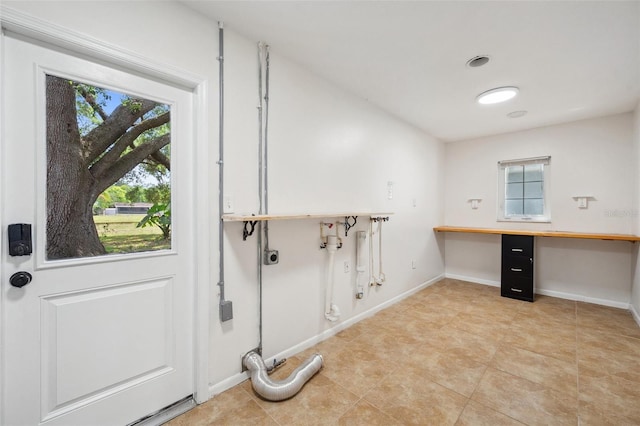 1308 W Perdiz St, Tampa, FL 33612 - clothes washing area with baseboards, gas dryer hookup, laundry area, and light tile patterned floors