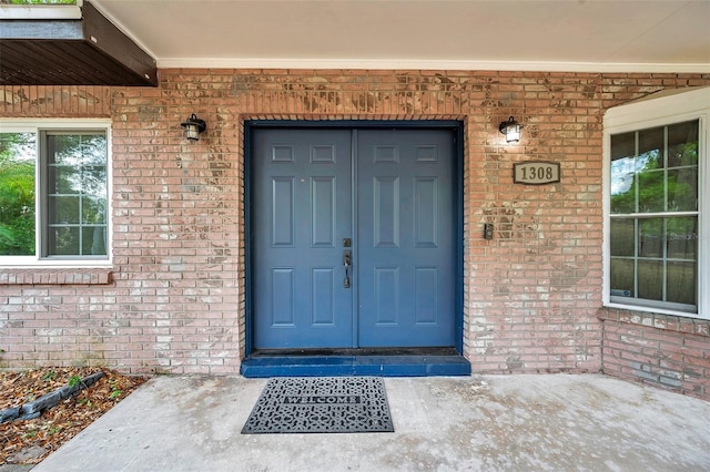 1308 W Perdiz St, Tampa, FL 33612 - entrance to property featuring covered porch and brick siding