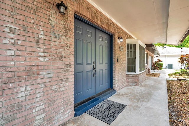 1308 W Perdiz St, Tampa, FL 33612 - view of exterior entry with covered porch and brick siding