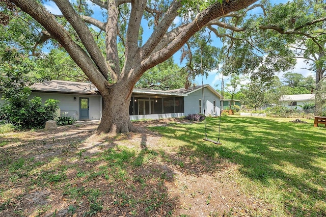 1308 W Perdiz St, Tampa, FL 33612 - view of yard featuring a sunroom