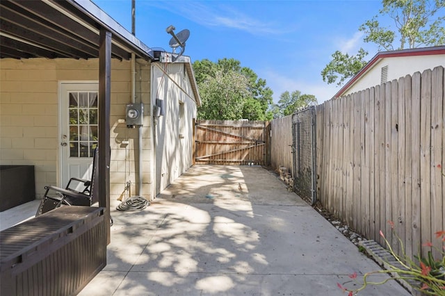 view of patio featuring fence