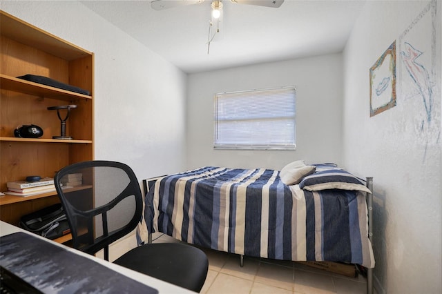 bedroom with ceiling fan and tile patterned floors