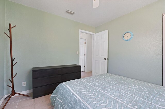bedroom featuring light tile patterned floors, baseboards, and visible vents