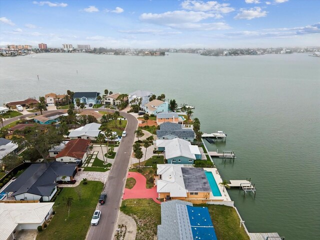 birds eye view of property featuring a water view and a residential view