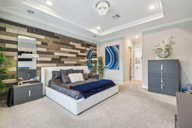 carpeted bedroom with baseboards, recessed lighting, a tray ceiling, and ornamental molding