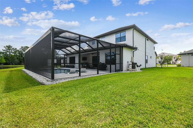 back of house featuring a patio area, a yard, glass enclosure, and stucco siding