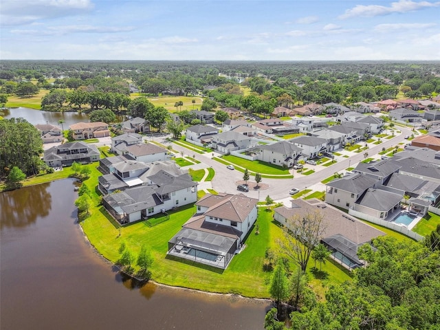 birds eye view of property featuring a water view and a residential view