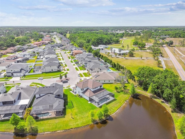 birds eye view of property with a water view and a residential view