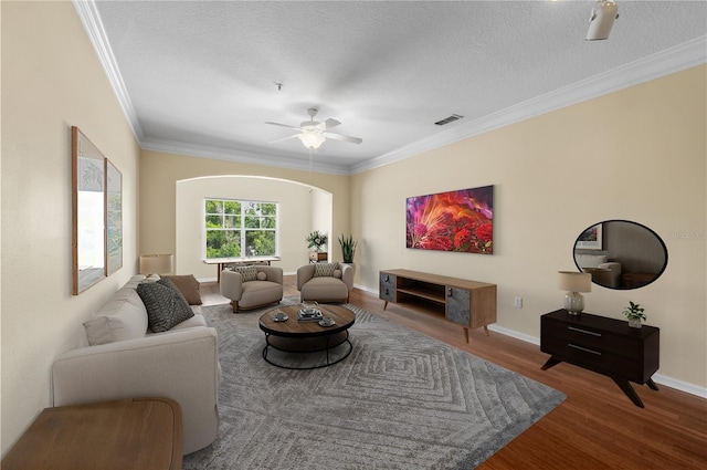 4207 S Dale Mabry Hwy Unit 3302, Tampa, FL 33611 - living room with crown molding, wood finished floors, a textured ceiling, visible vents, and ceiling fan