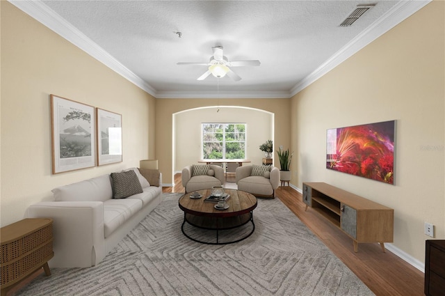 4207 S Dale Mabry Hwy Unit 3302, Tampa, FL 33611 - living room featuring visible vents, baseboards, ornamental molding, wood finished floors, and a ceiling fan