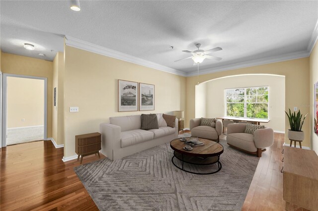 4207 S Dale Mabry Hwy Unit 3302, Tampa, FL 33611 - living area with a textured ceiling, crown molding, baseboards, a ceiling fan, and wood-type flooring