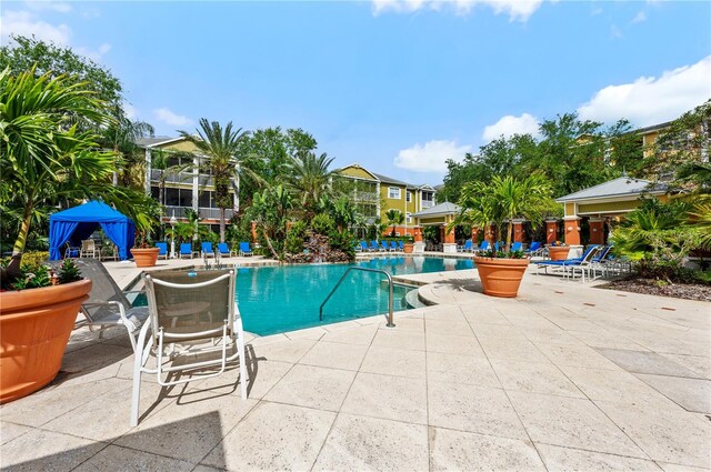 4207 S Dale Mabry Hwy Unit 3302, Tampa, FL 33611 - community pool featuring a patio area