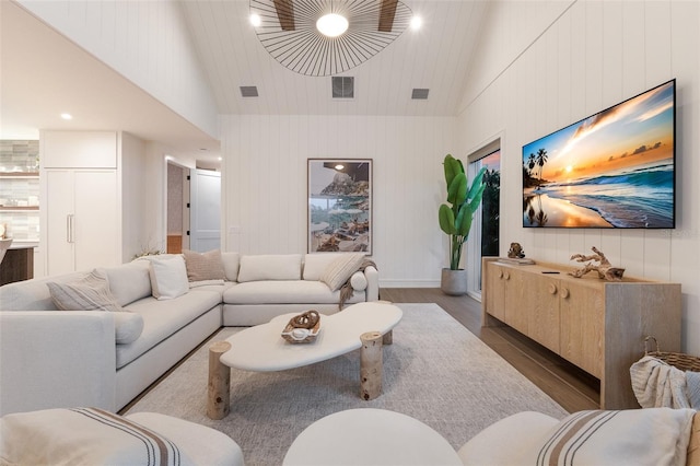 311 Spring Ave, Anna Maria, FL 34216 - living room featuring visible vents, high vaulted ceiling, and wood finished floors