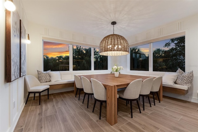 311 Spring Ave, Anna Maria, FL 34216 - dining room featuring an inviting chandelier and wood finish floors