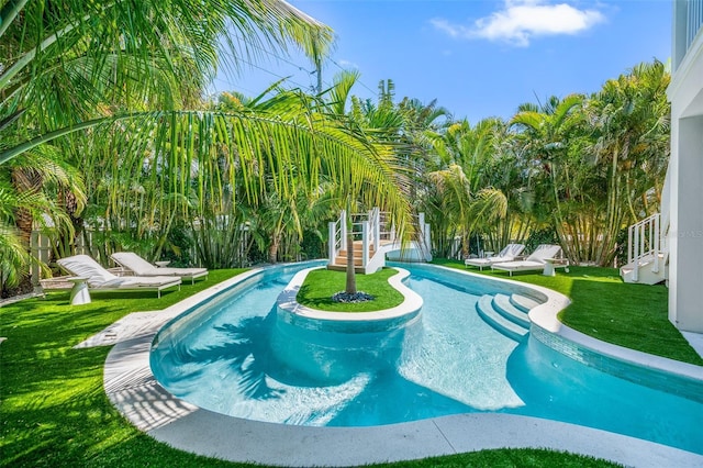 311 Spring Ave, Anna Maria, FL 34216 - outdoor pool featuring a lawn and fence