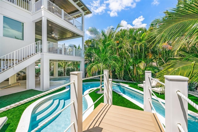 311 Spring Ave, Anna Maria, FL 34216 - pool with an in ground hot tub, a patio area, and stairway