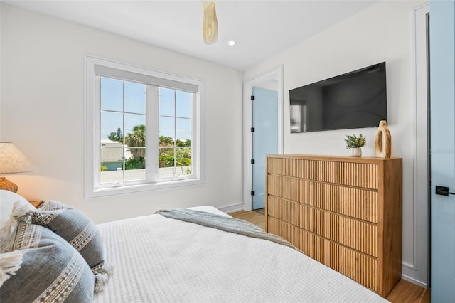 311 Spring Ave, Anna Maria, FL 34216 - bedroom with baseboards, wood finished floors, and recessed lighting