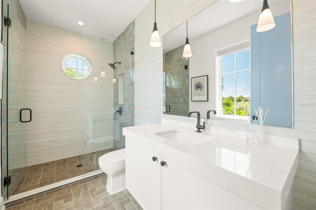 311 Spring Ave, Anna Maria, FL 34216 - bathroom featuring toilet, vanity, and a stall shower