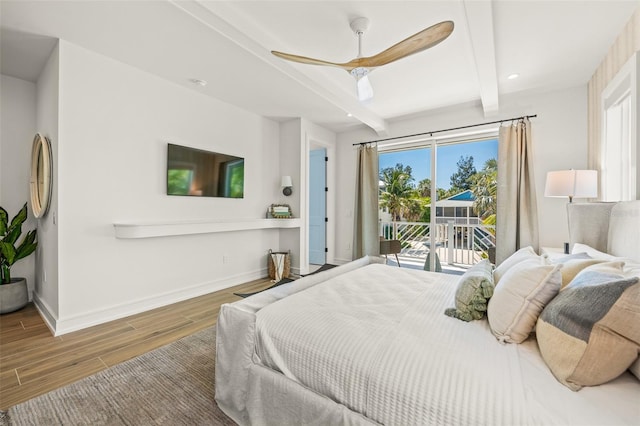 311 Spring Ave, Anna Maria, FL 34216 - bedroom featuring baseboards, access to outside, beam ceiling, ceiling fan, and wood finished floors