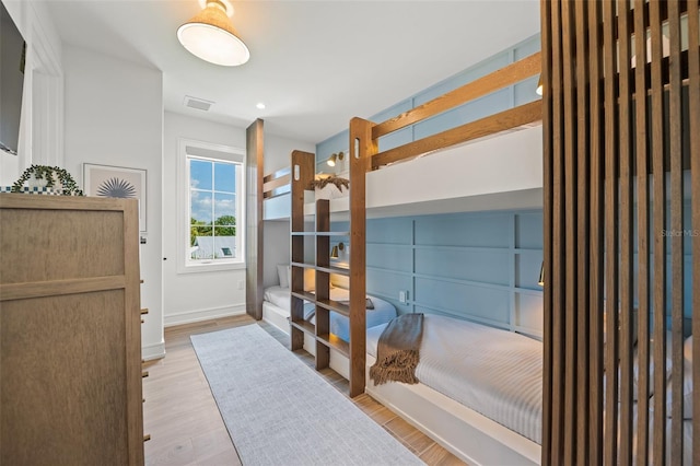 311 Spring Ave, Anna Maria, FL 34216 - bedroom with light wood-type flooring, baseboards, and visible vents
