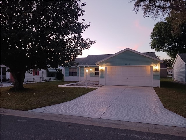1219 Santos Pl, Lady Lake, FL 32159 - single story home featuring a lawn, a garage, and concrete driveway