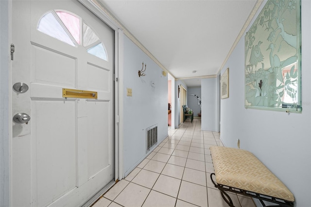 corridor featuring light tile patterned floors and visible vents