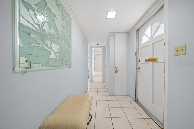 hall featuring light tile patterned floors