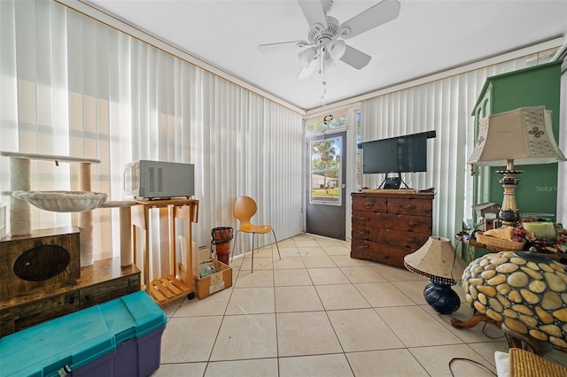 interior space featuring ceiling fan and tile patterned flooring