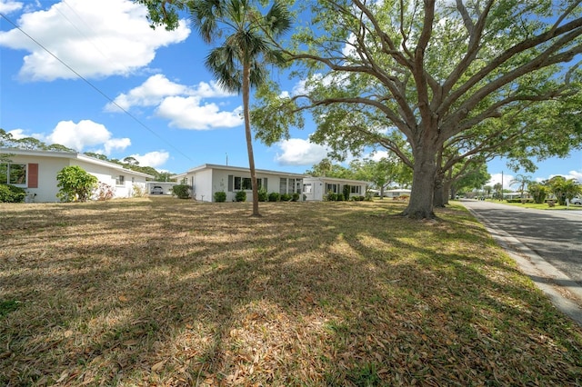 view of front of property with a front lawn