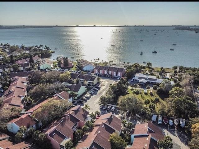 drone / aerial view featuring a residential view and a water view
