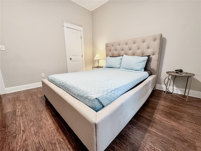 1515 E 31st Ave, Tampa, FL 33610 - bedroom featuring baseboards and dark wood-style flooring