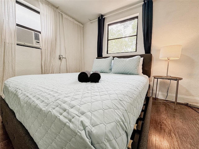1515 E 31st Ave, Tampa, FL 33610 - bedroom featuring baseboards, a textured wall, wood finished floors, and cooling unit