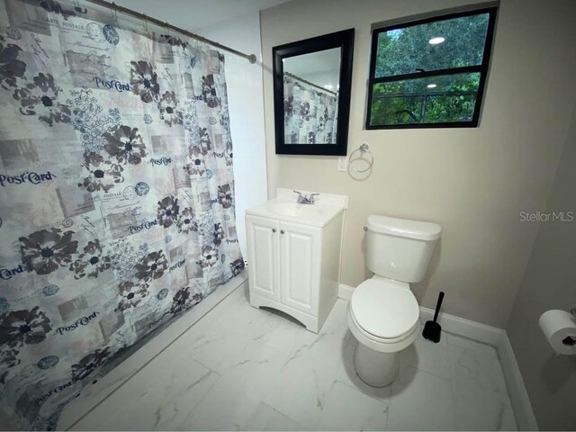 1515 E 31st Ave, Tampa, FL 33610 - full bathroom featuring baseboards, marble finish floor, toilet, and curtained shower