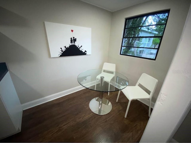 1515 E 31st Ave, Tampa, FL 33610 - living area with baseboards and wood finished floors