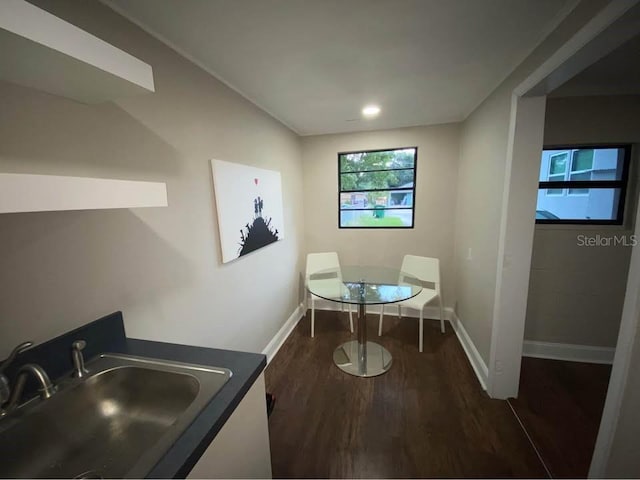 1515 E 31st Ave, Tampa, FL 33610 - dining space featuring dark wood-type flooring and baseboards