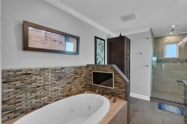 bathroom featuring a shower stall, baseboards, crown molding, and a jetted tub