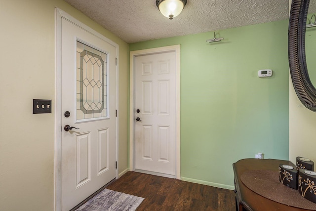 6831 Greenwich Ave, New Port Richey, FL 34653 - entrance foyer with a textured ceiling, baseboards, and dark wood-style flooring