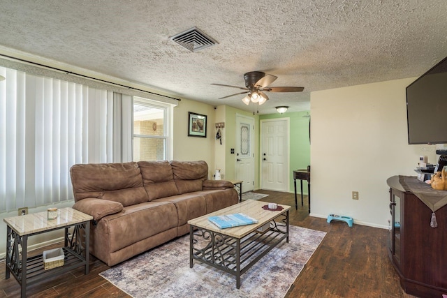 6831 Greenwich Ave, New Port Richey, FL 34653 - living room with a textured ceiling, visible vents, baseboards, wood finished floors, and a ceiling fan