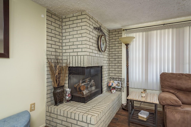 6831 Greenwich Ave, New Port Richey, FL 34653 - living room with wood finished floors, baseboards, a fireplace, and a textured ceiling